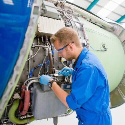 Engineer working on an airplane engine