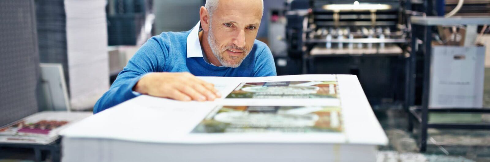 Printer inspecting press sheets