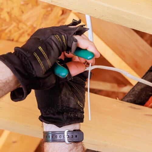 Electrician wiring a new home