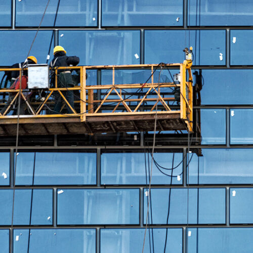 Workers washing windows on a skyscraper