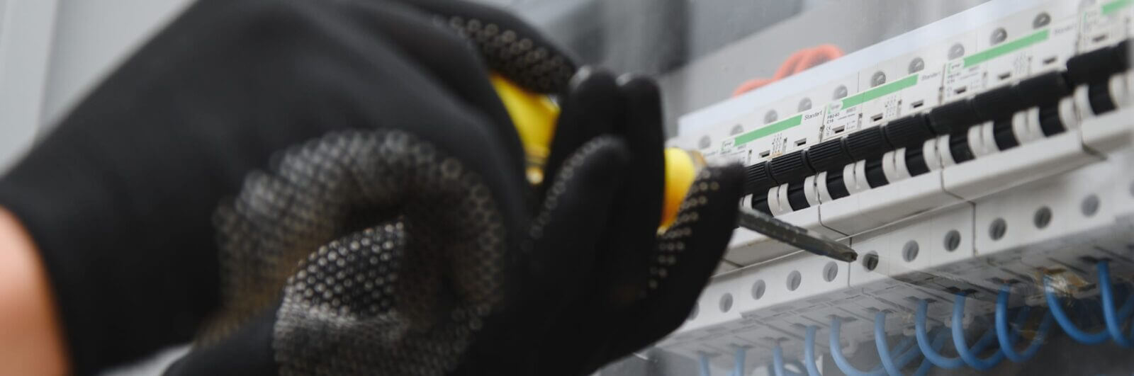 Electrician wiring circuit breakers