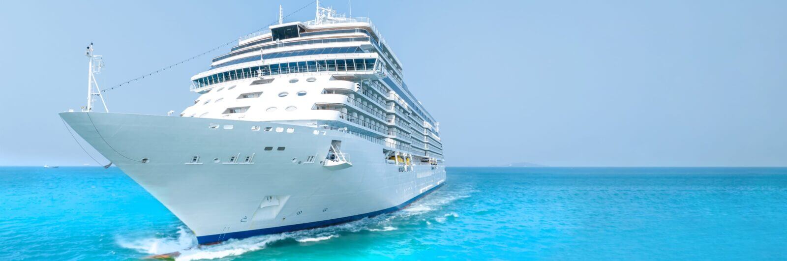 Cruise ship sailing over turquoise blue waters