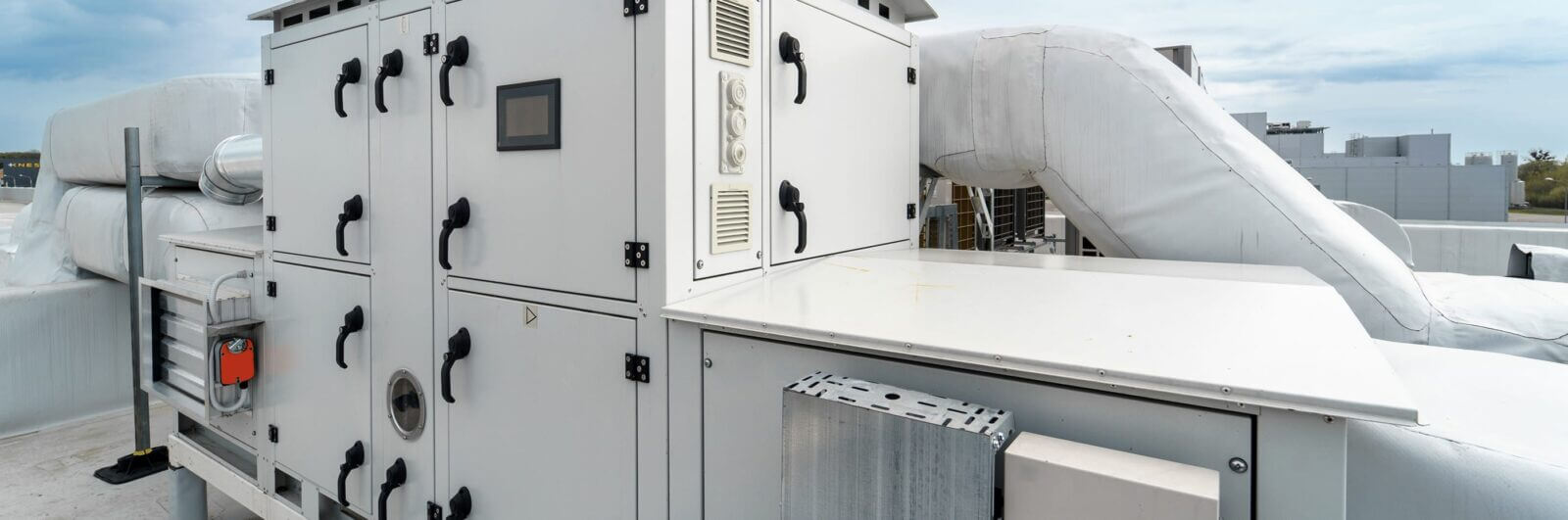 HVAC equipment on the roof of a tall building